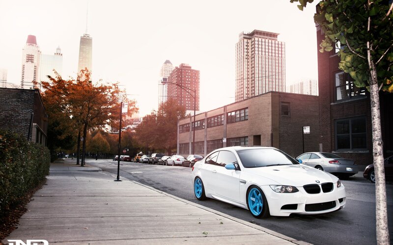 White BMW on city street