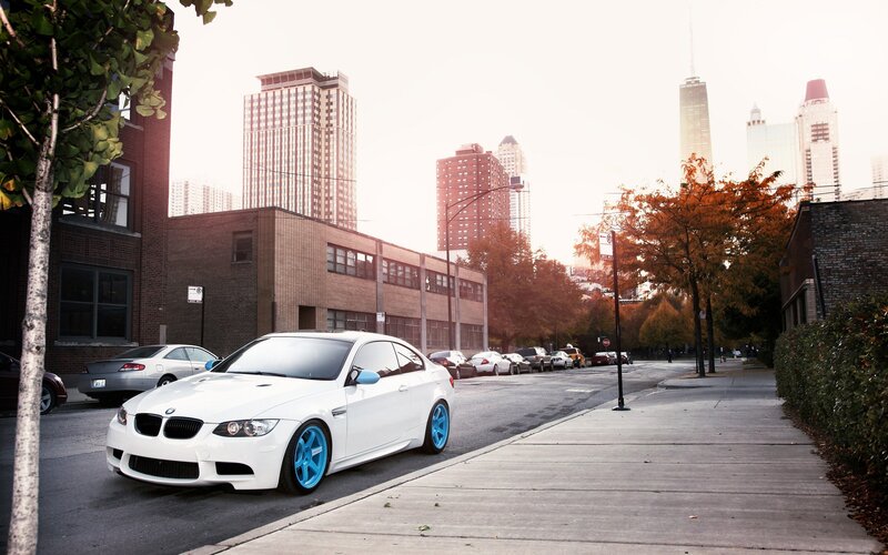 White BMW on city street