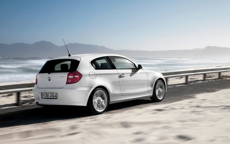 White BMW on coastal road