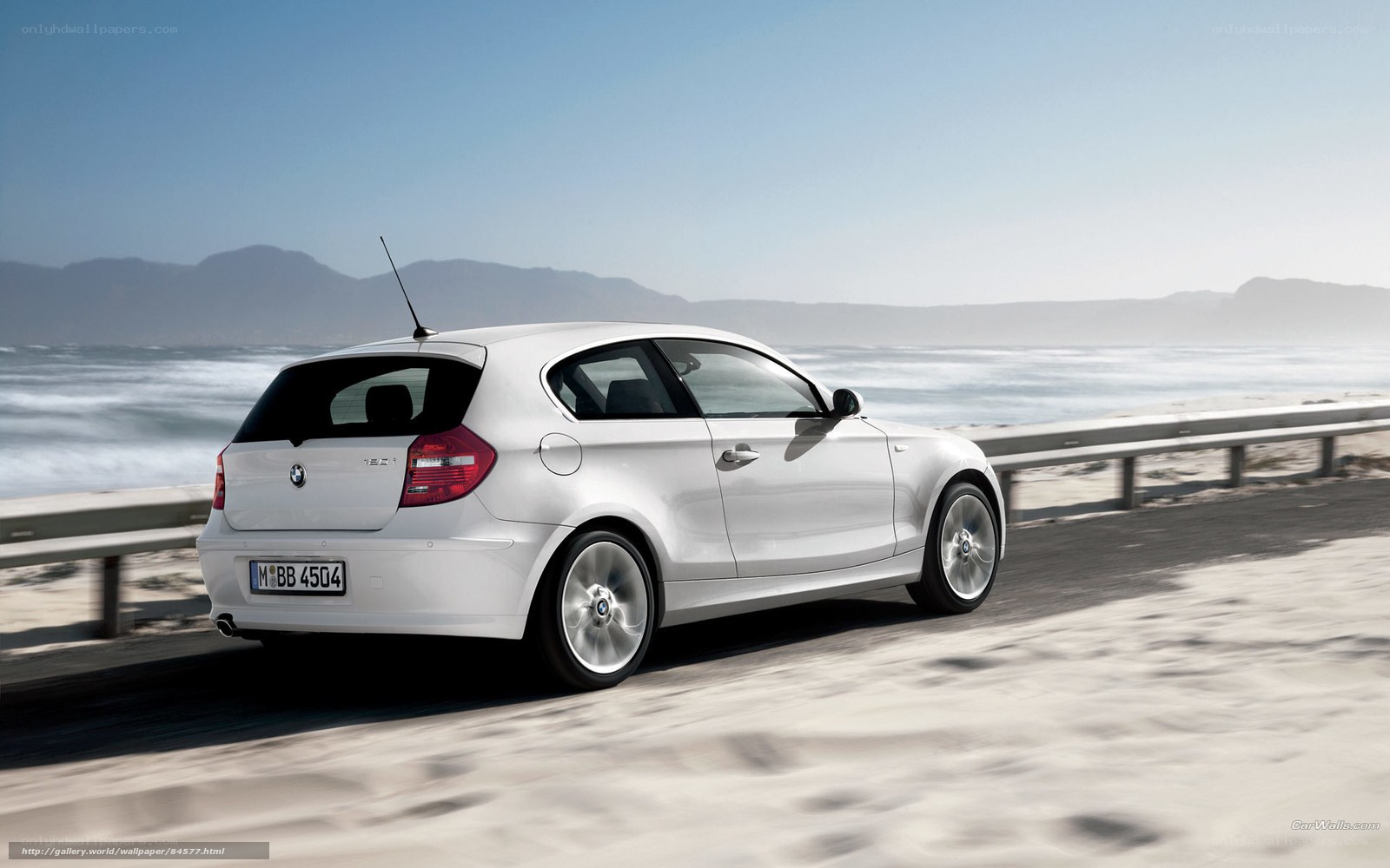 White BMW on coastal road