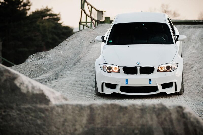 White BMW on gravel road