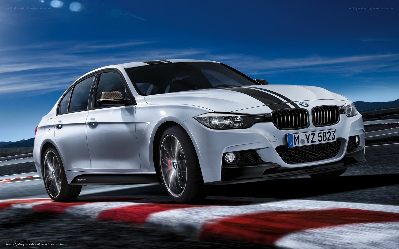 white bmw on racetrack