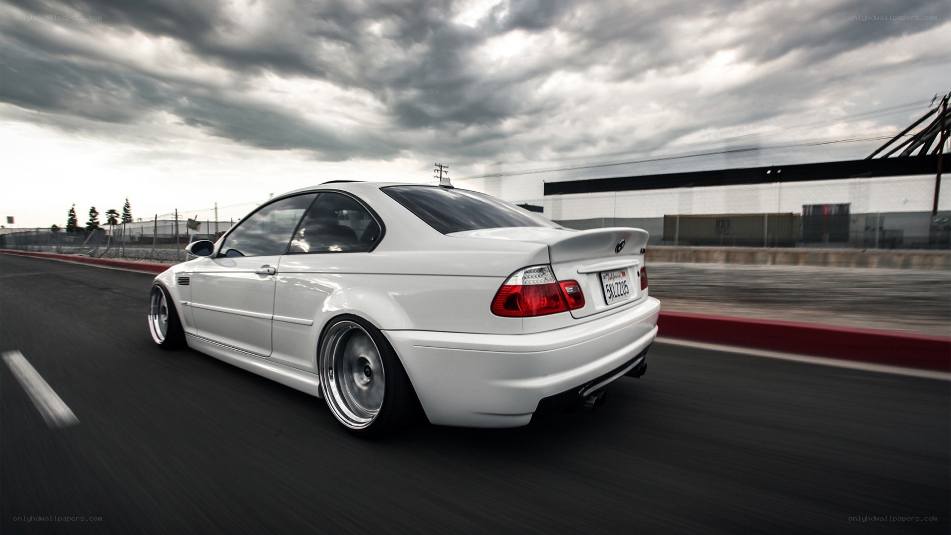 white bmw on racetrack