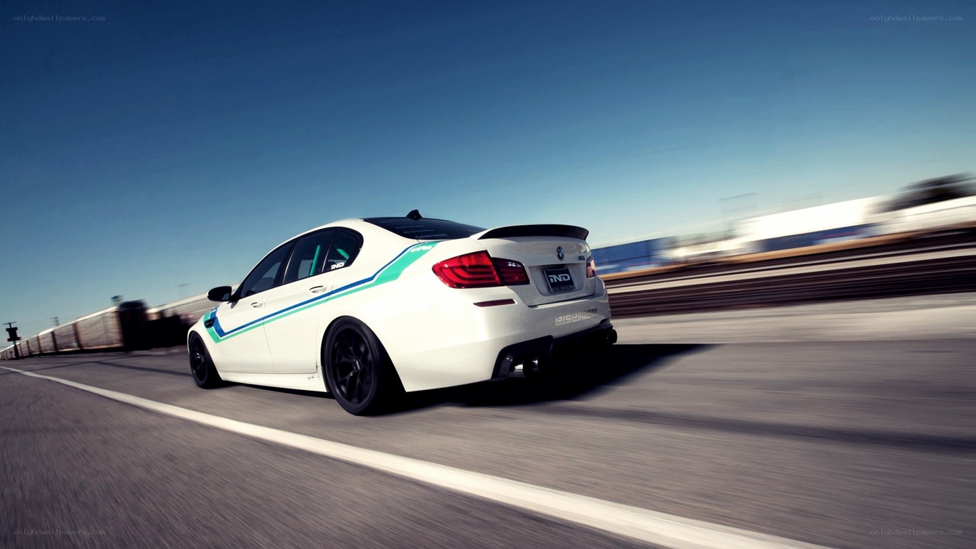 white bmw on racetrack