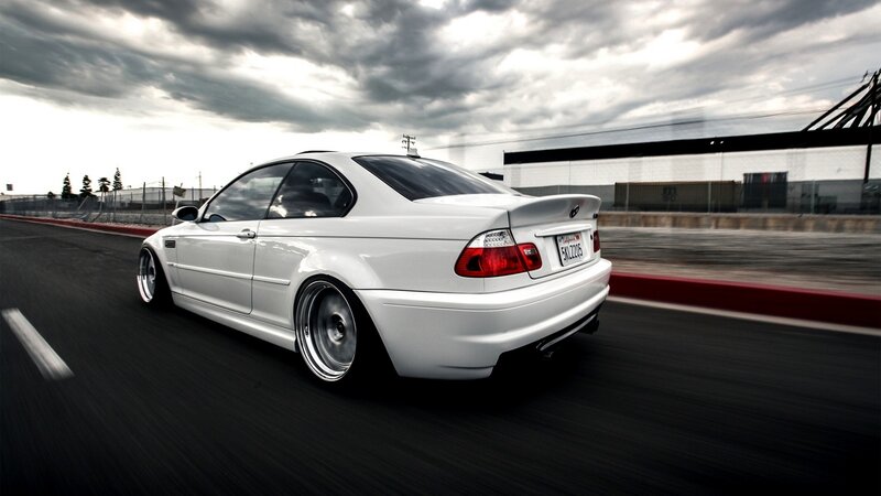 white bmw on racetrack