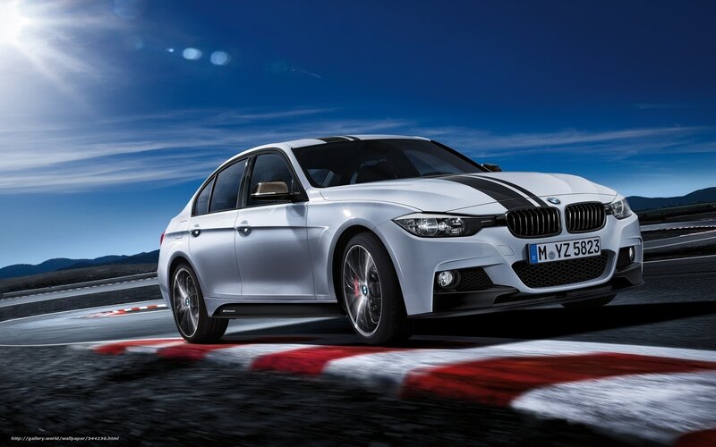 White BMW on racetrack