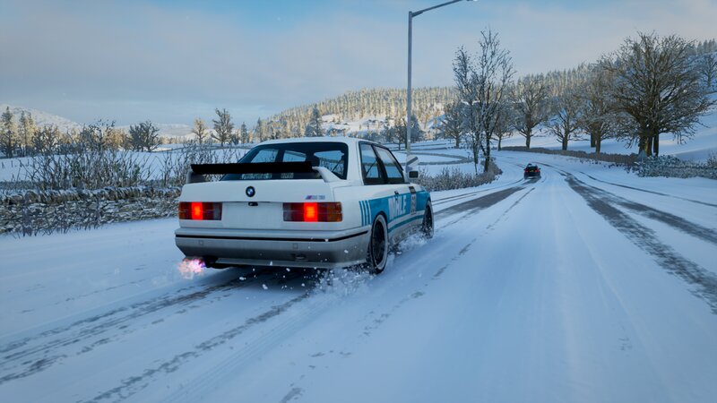 White BMW on Snowy Road