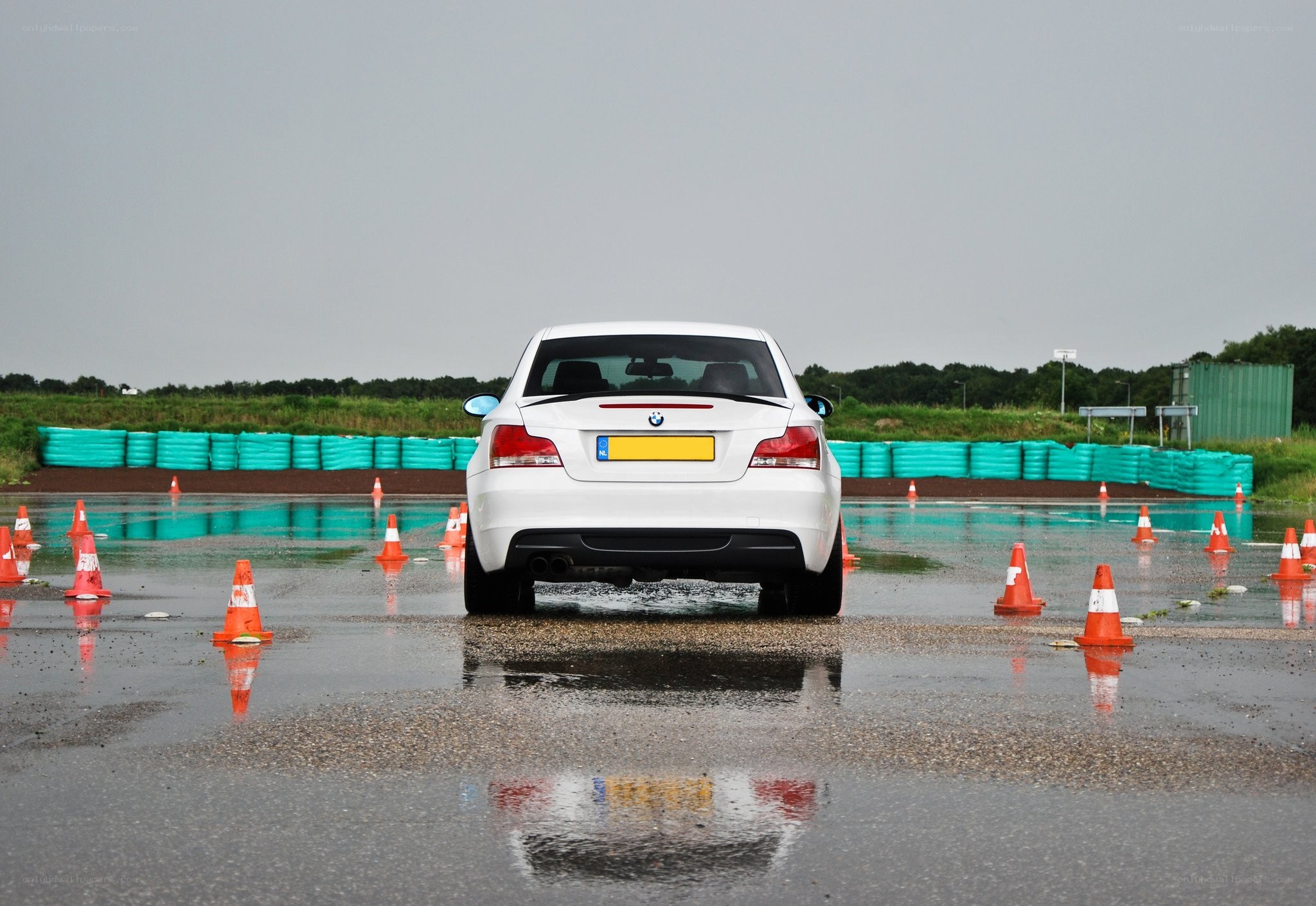 White BMW on wet track
