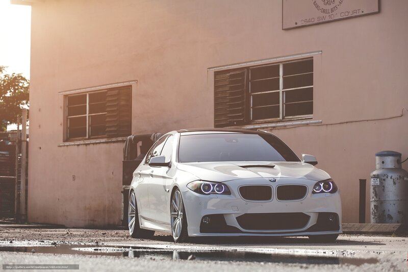 White BMW parked in alley