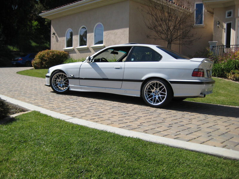 White BMW parked on driveway