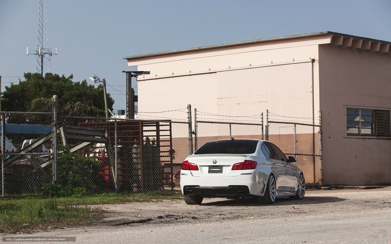 white bmw parked outside