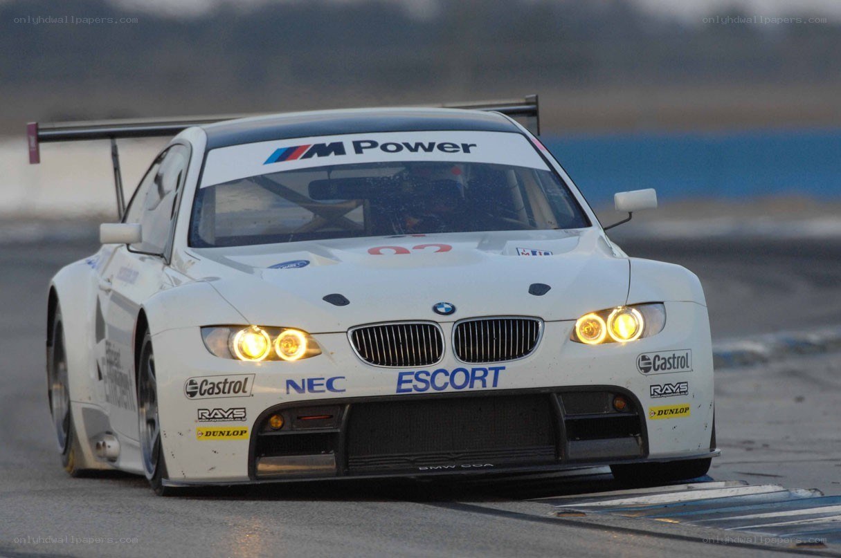 white bmw race car on track
