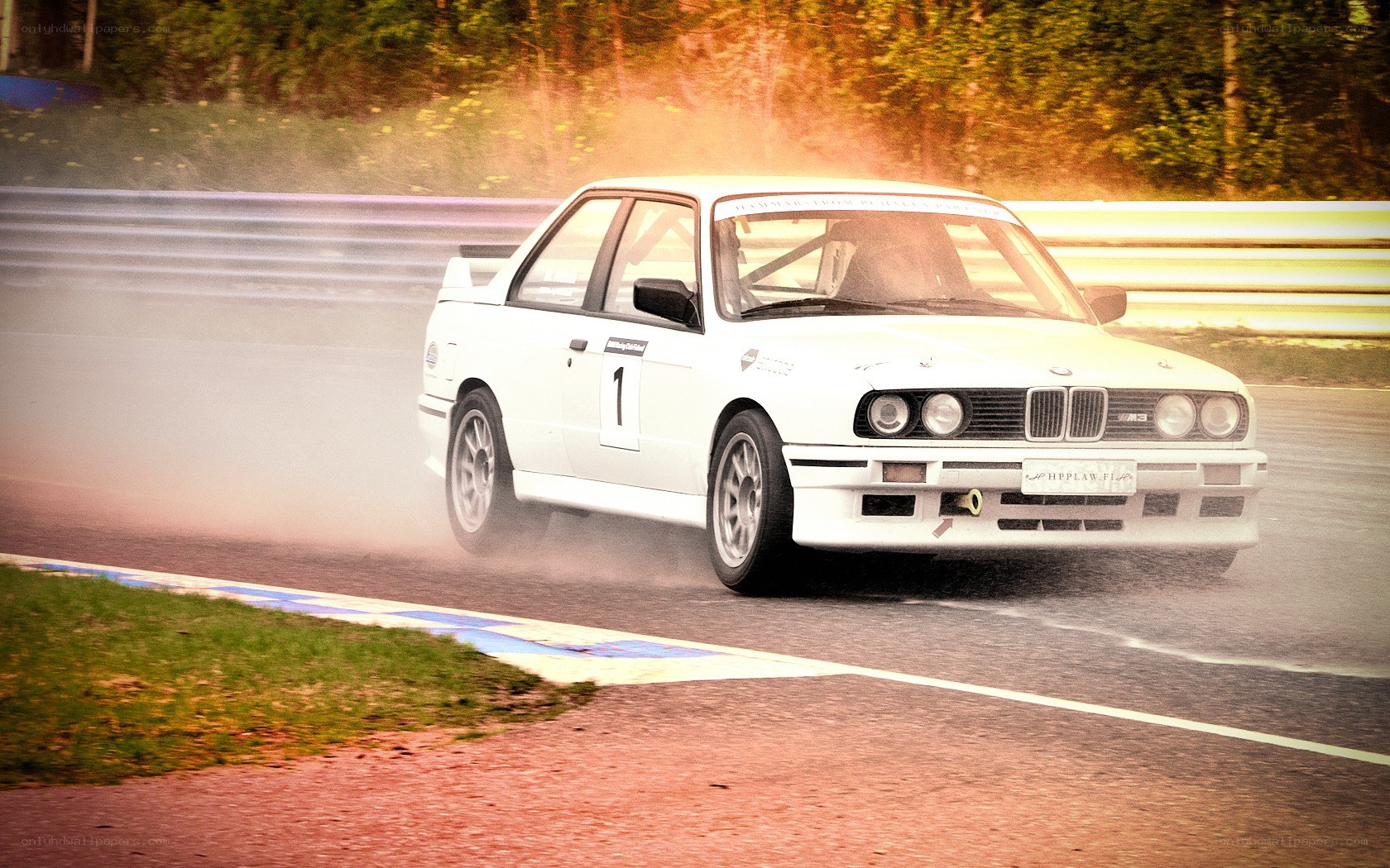 White BMW racing on track