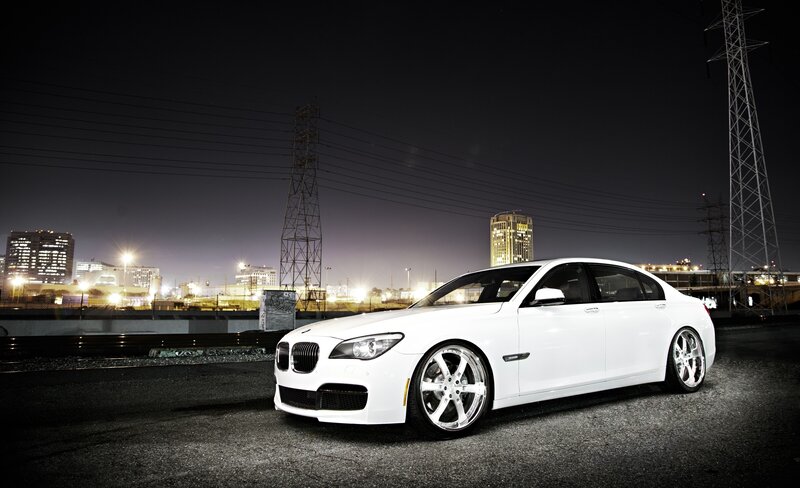 White BMW sedan at night