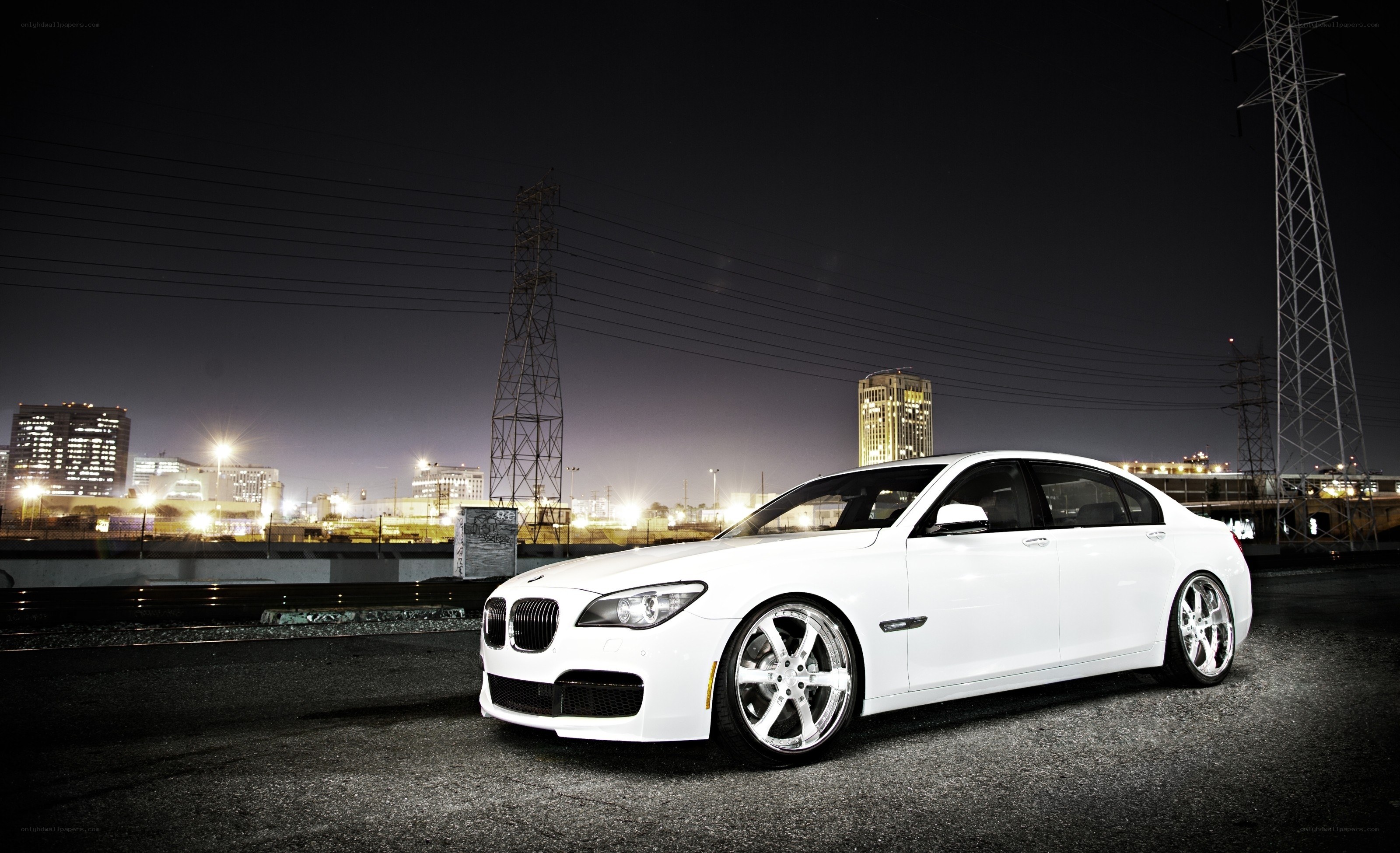 White BMW sedan at night