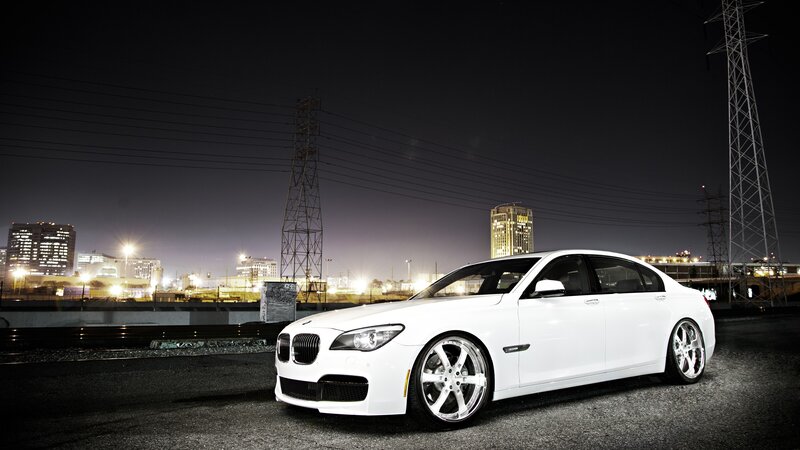 White BMW Sedan — Dramatic, Night, Photograph, City Skyline