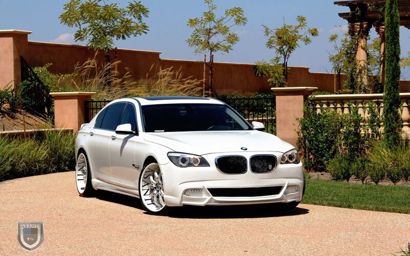 white bmw sedan in driveway