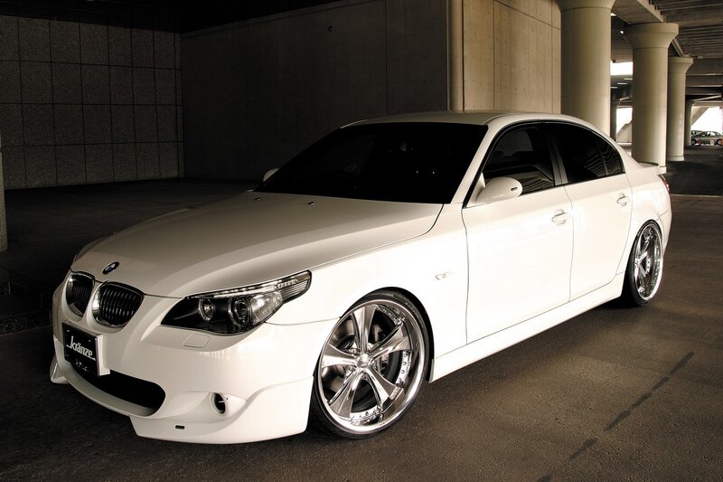white bmw sedan in garage