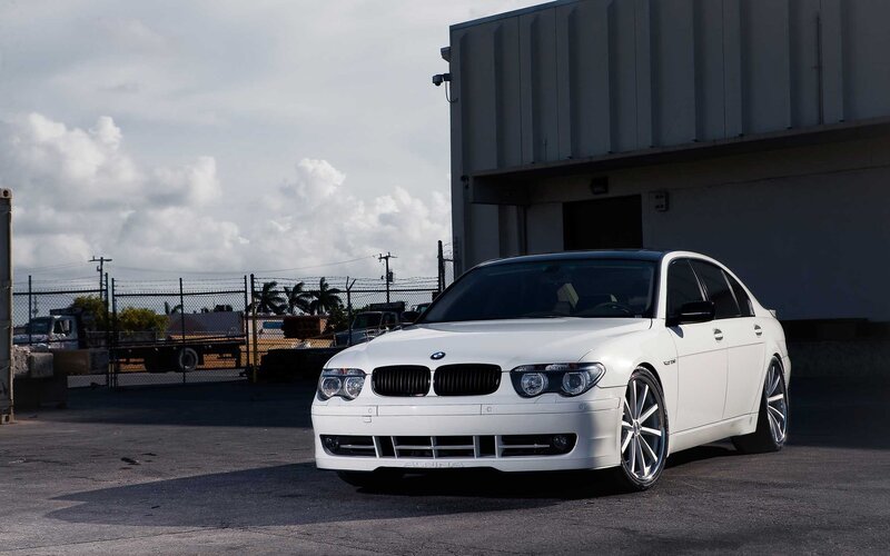 white bmw sedan in industrial area