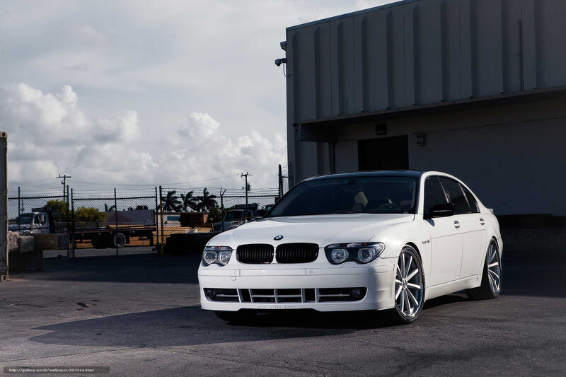 White BMW sedan in industrial lot