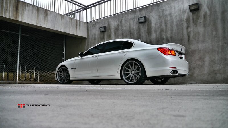 white bmw sedan in parking garage