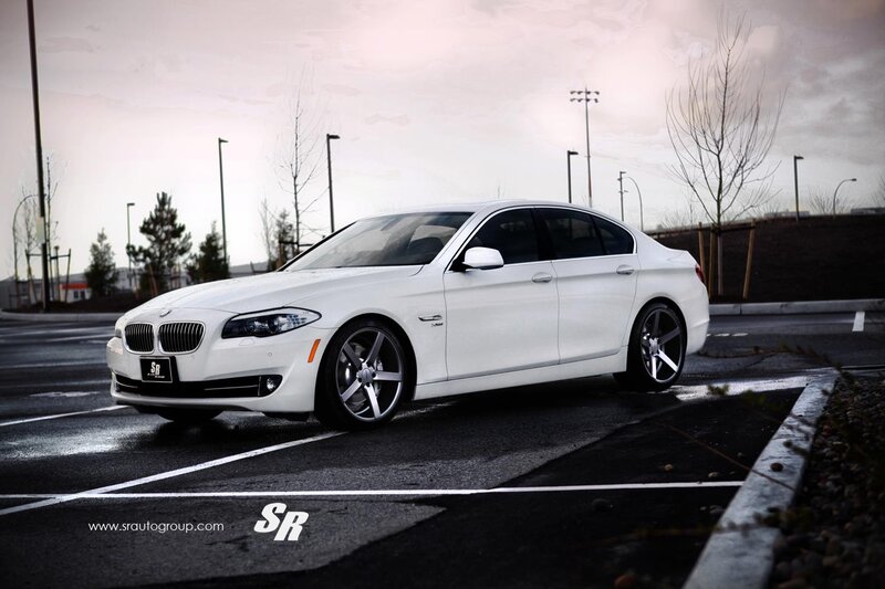 white bmw sedan in parking lot