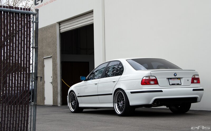 White Bmw Sedan — Neutral, Photograph, Building
