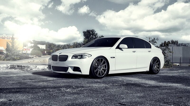 white bmw sedan on asphalt