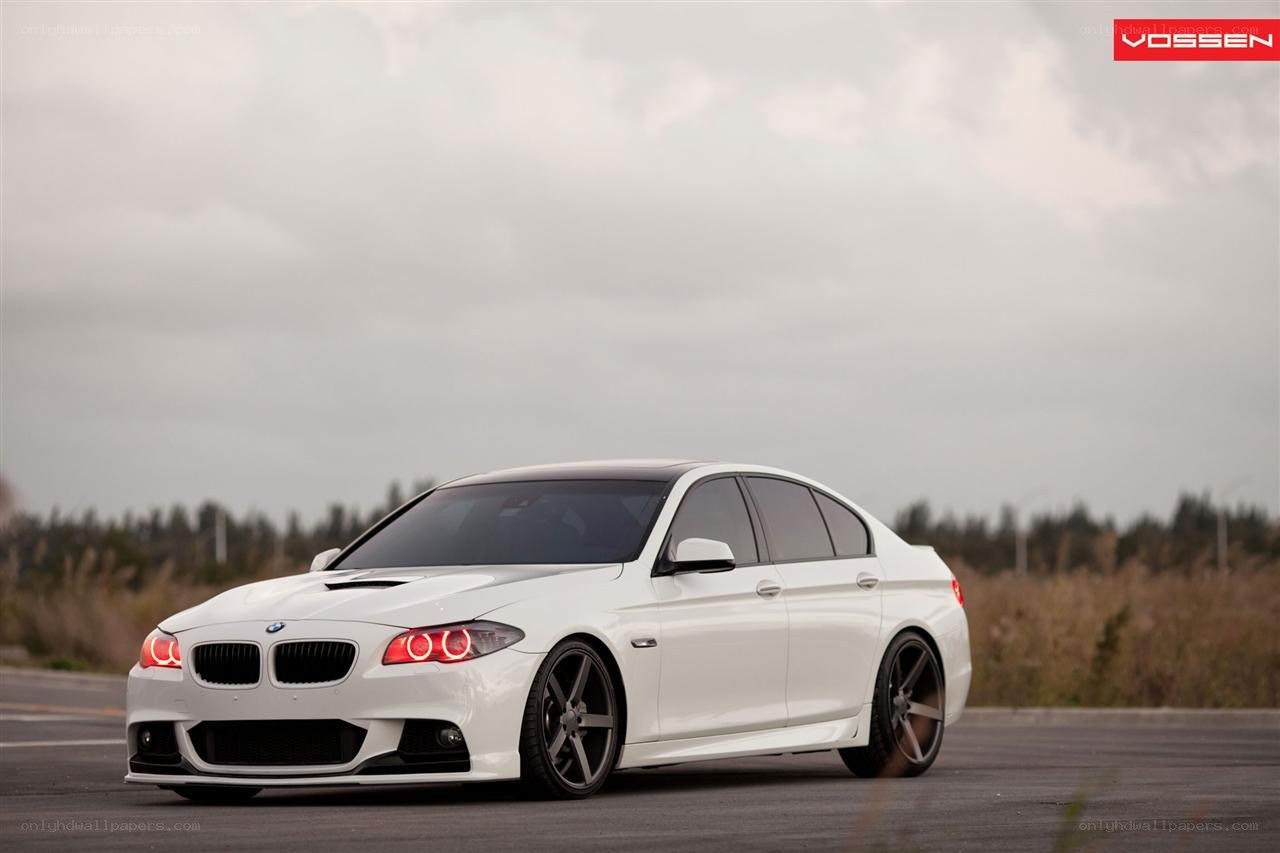 white bmw sedan on road