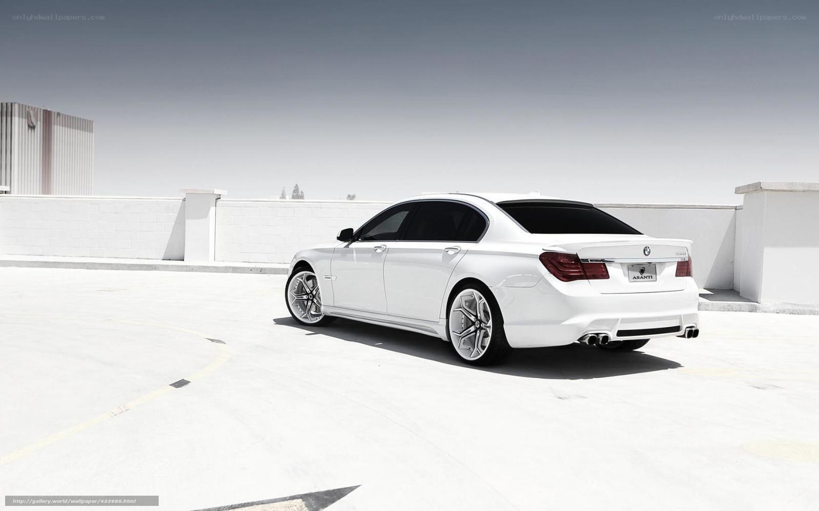 white bmw sedan on rooftop