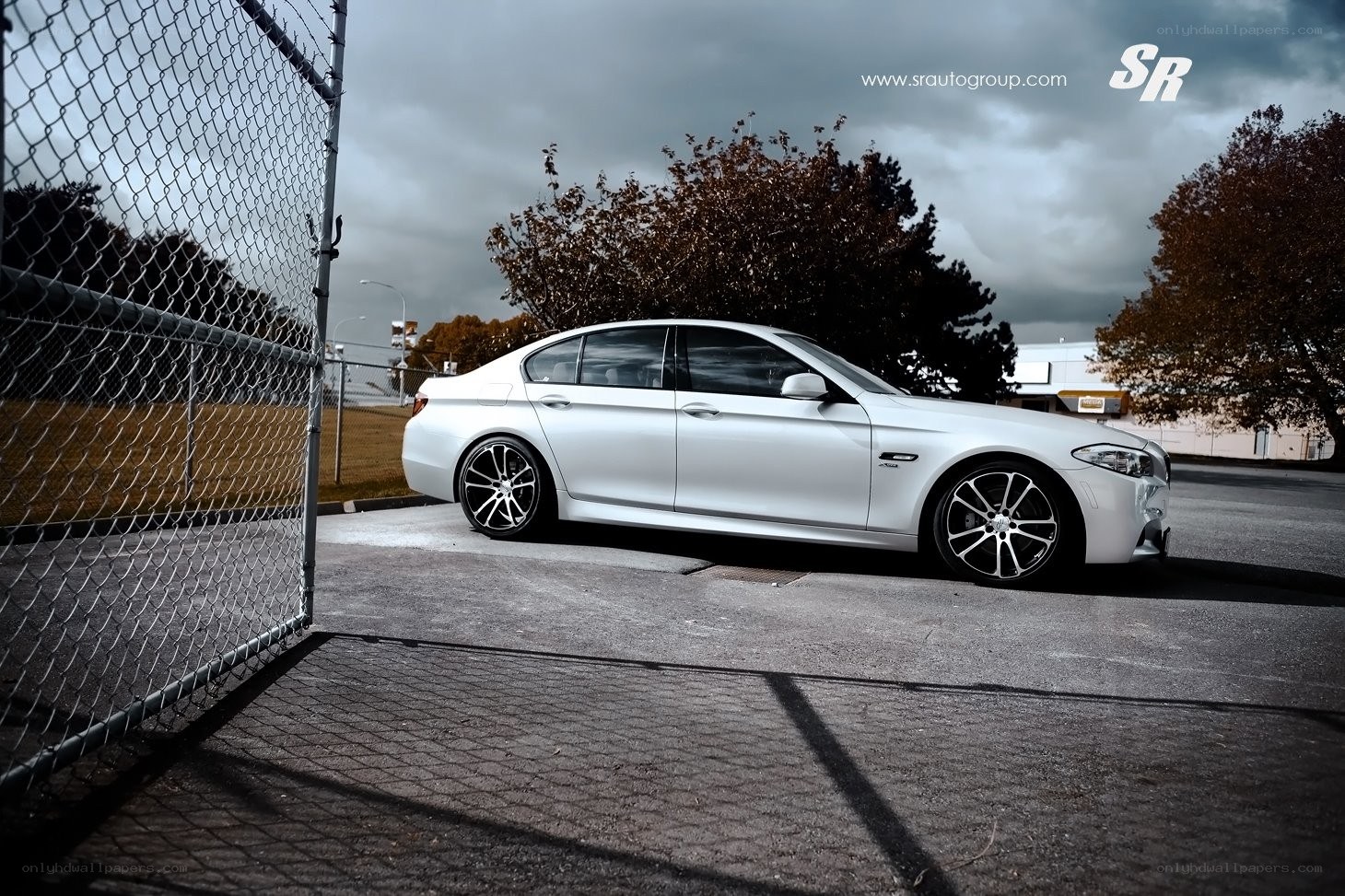 white bmw sedan parked