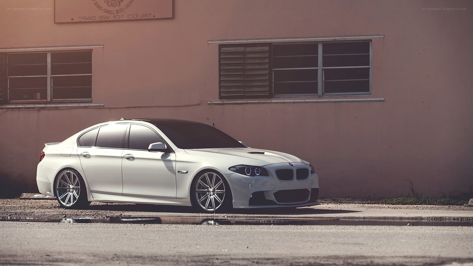 white bmw sedan parked