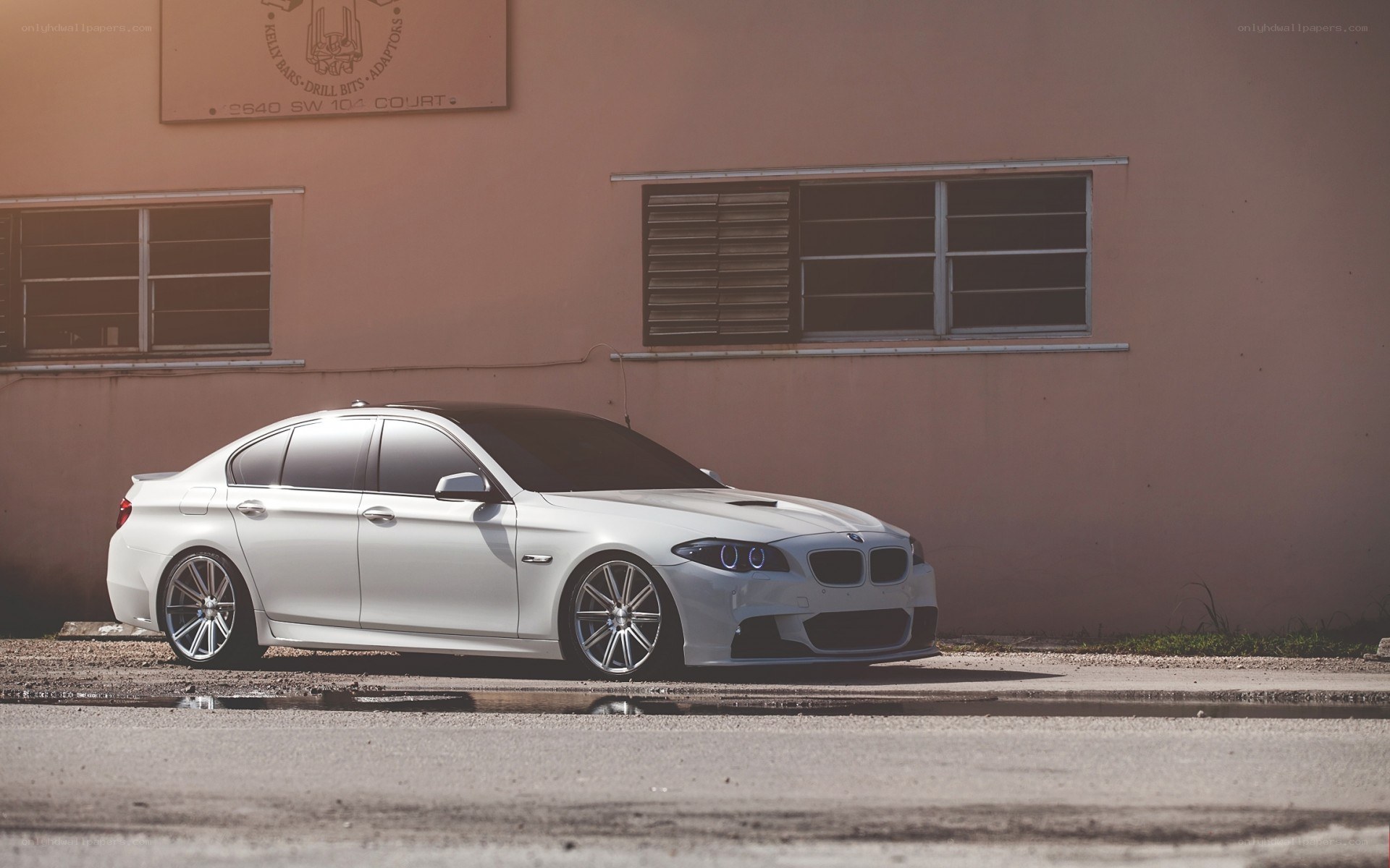 white bmw sedan parked