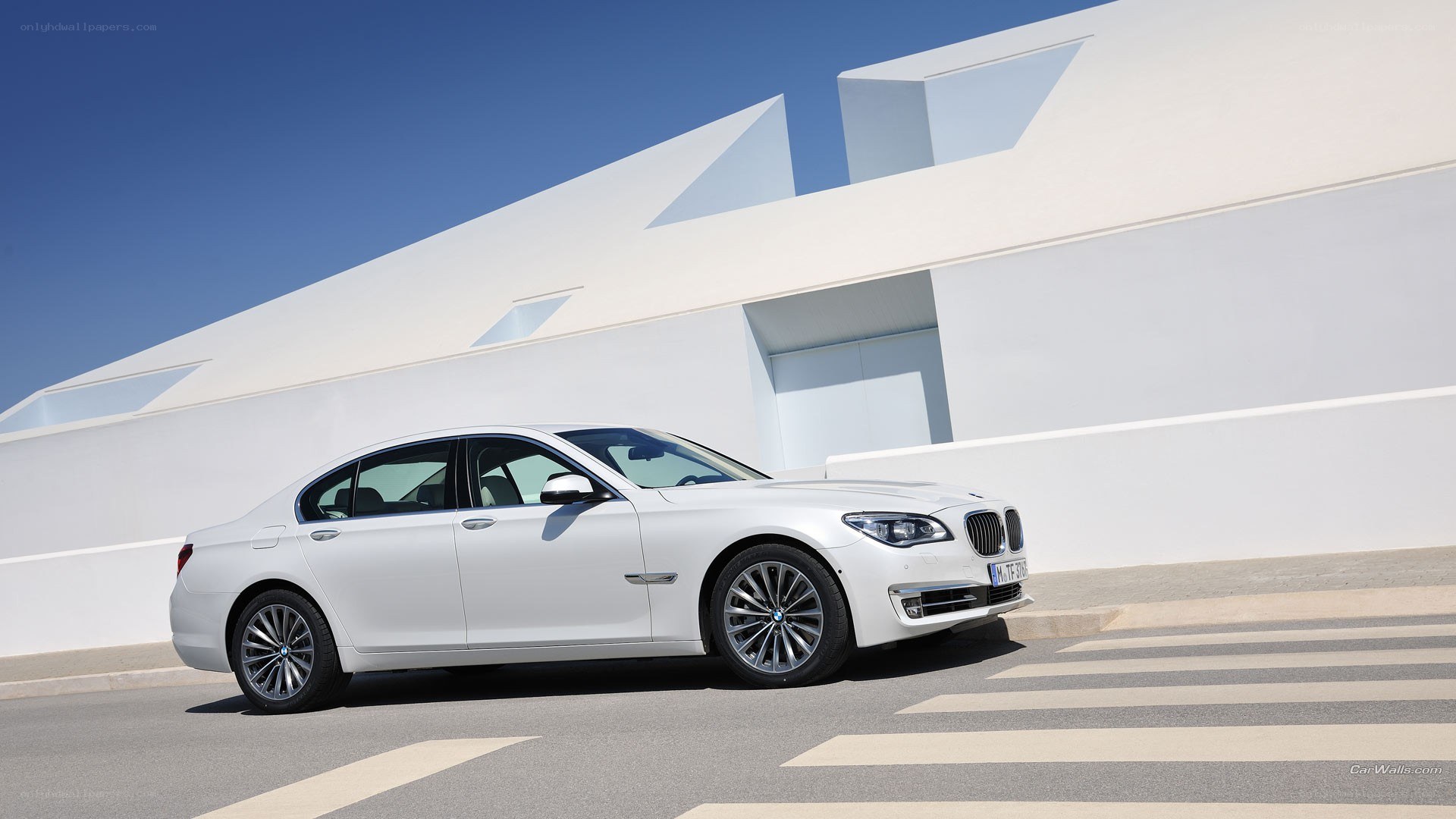 white bmw sedan parked