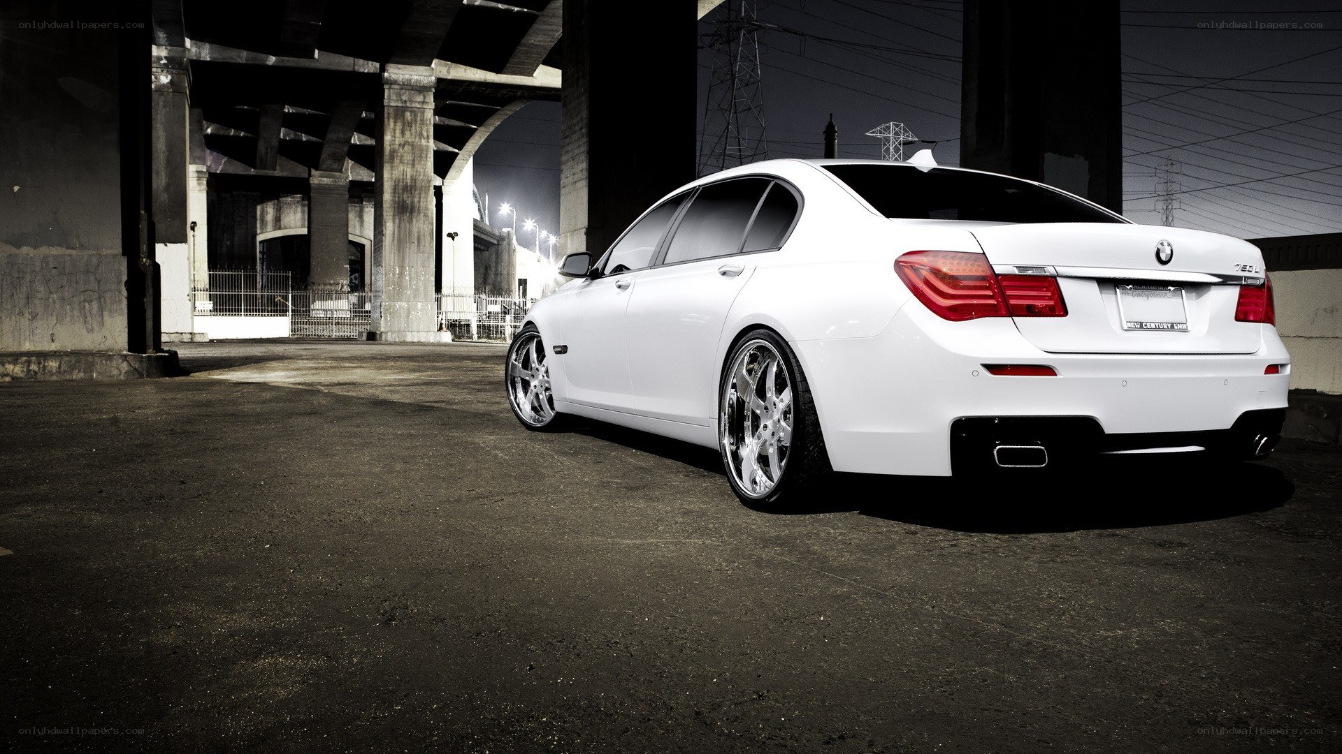 white bmw sedan under bridge