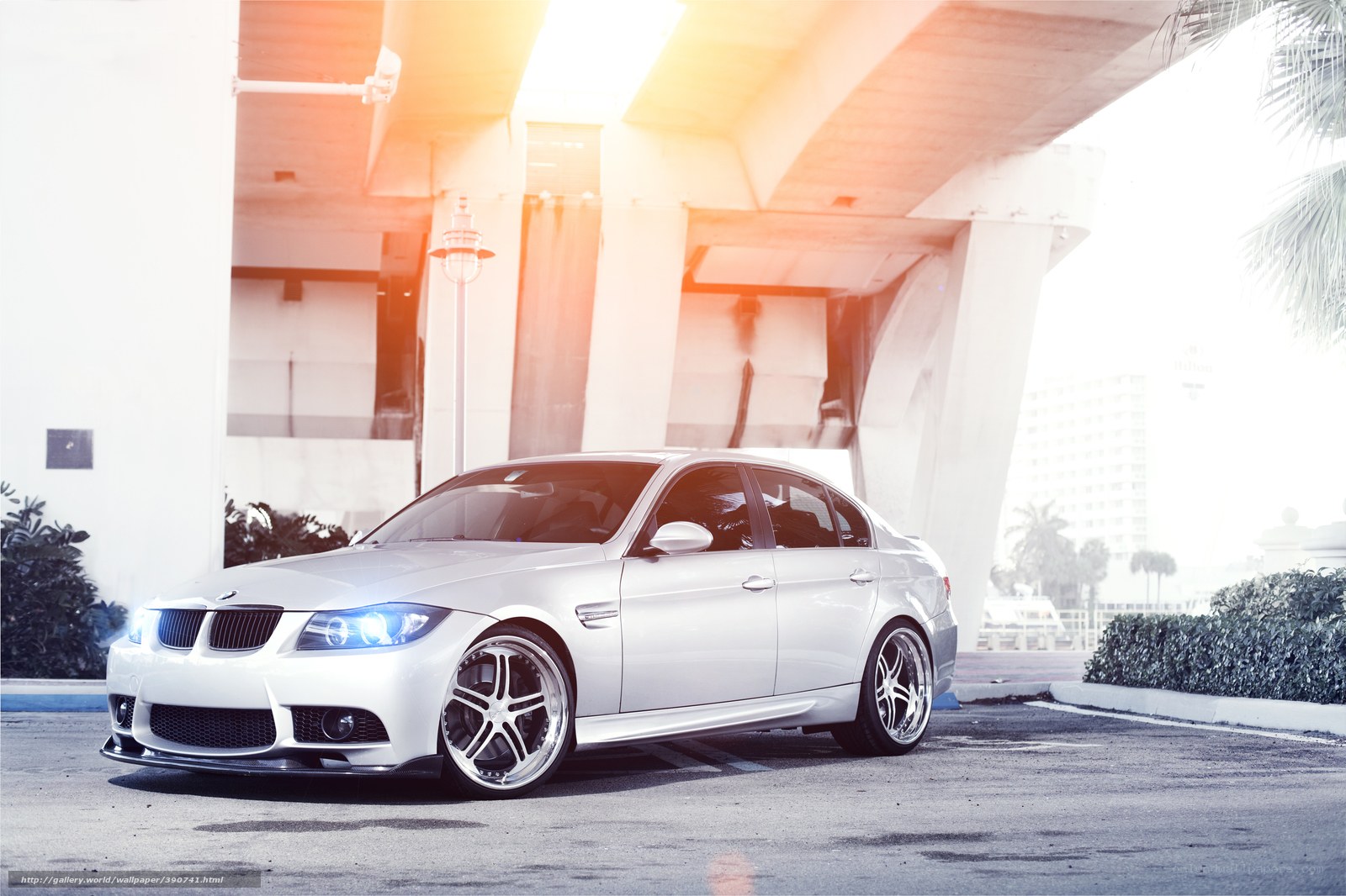 white bmw sedan under bridge