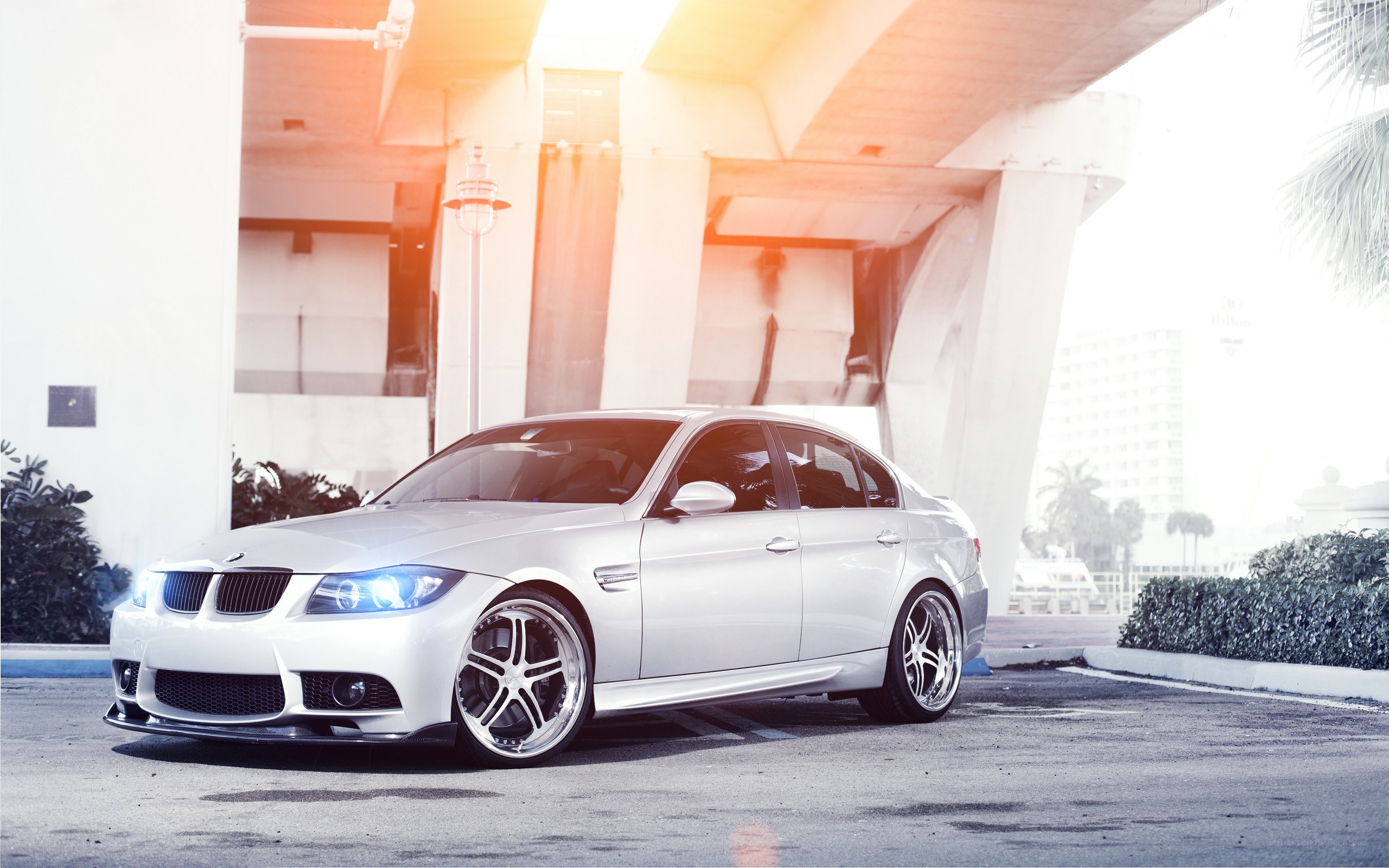 white bmw sedan under overpass
