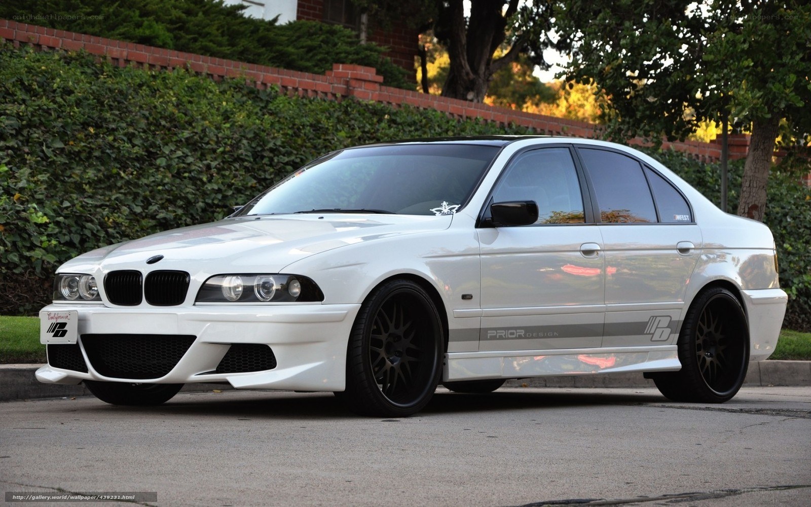 white bmw sedan with custom body kit