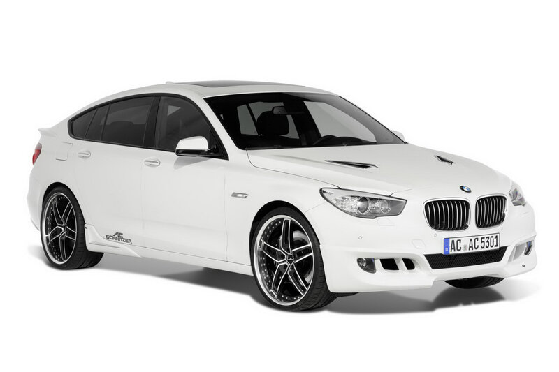 white bmw sedan with custom wheels
