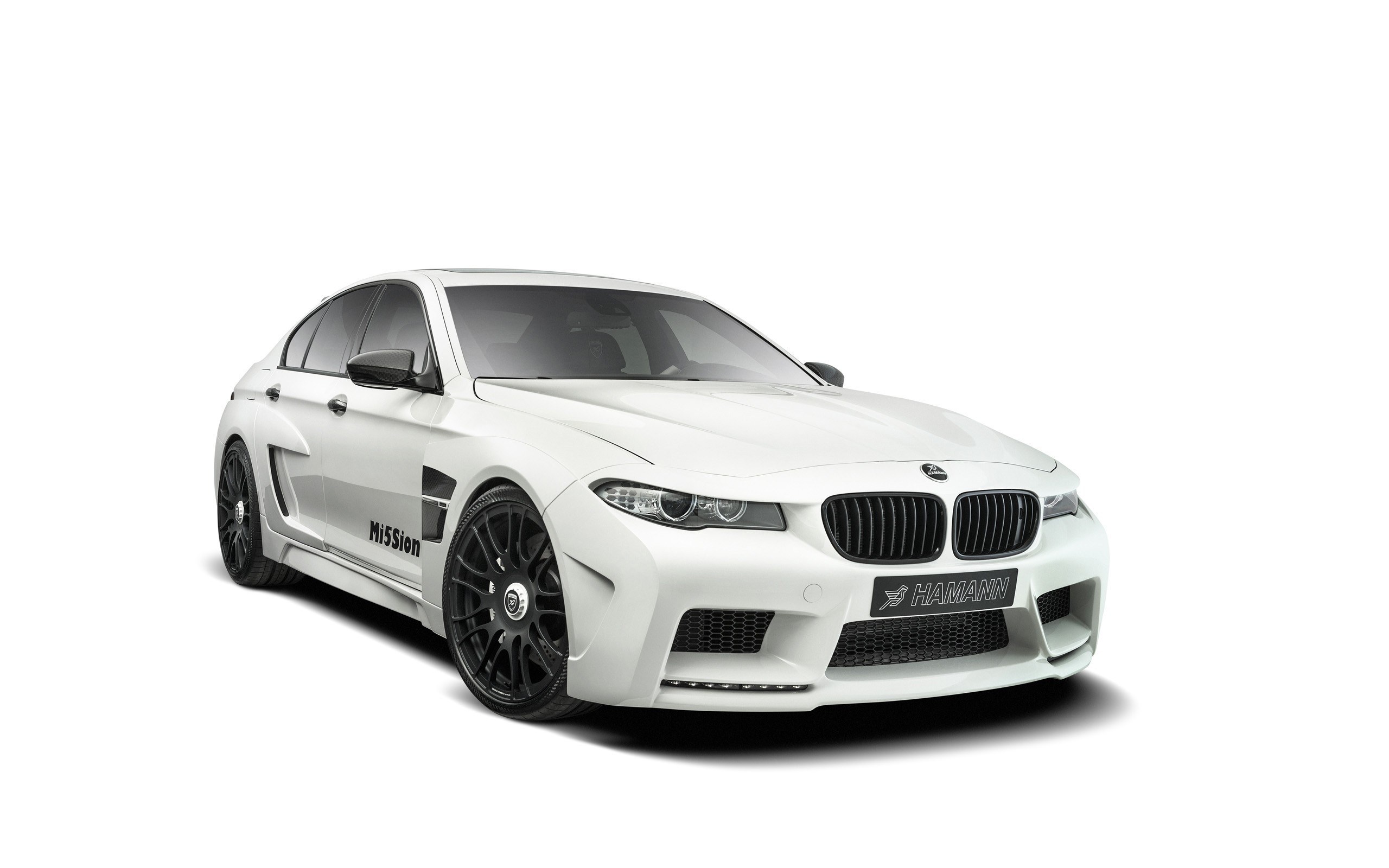 white bmw sedan with hamann modifications
