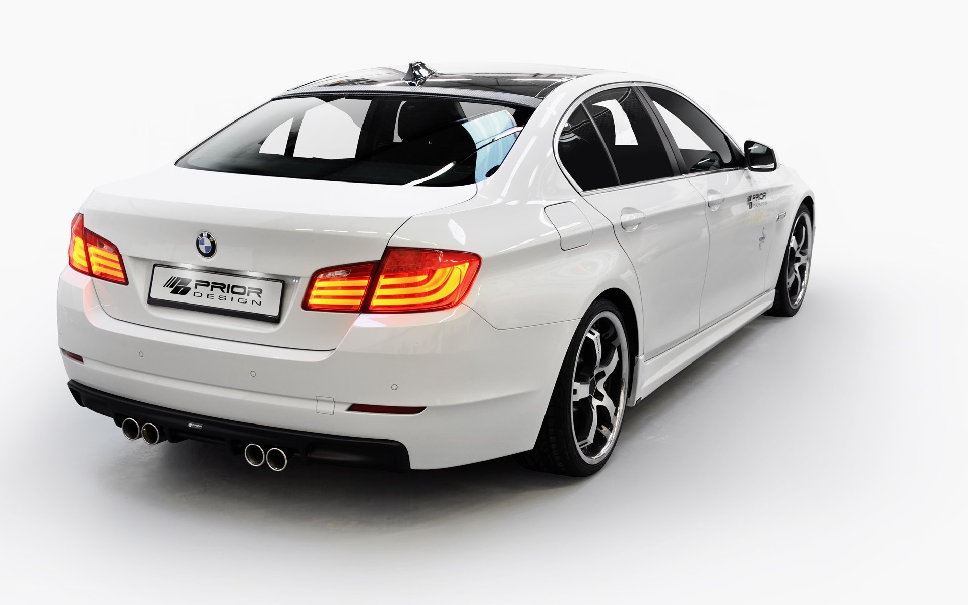 white bmw sedan with prior design