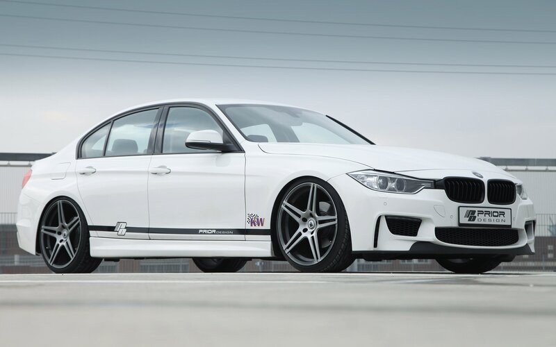white bmw sedan with prior design