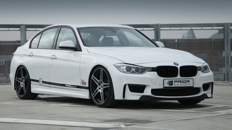 white bmw sedan with prior design