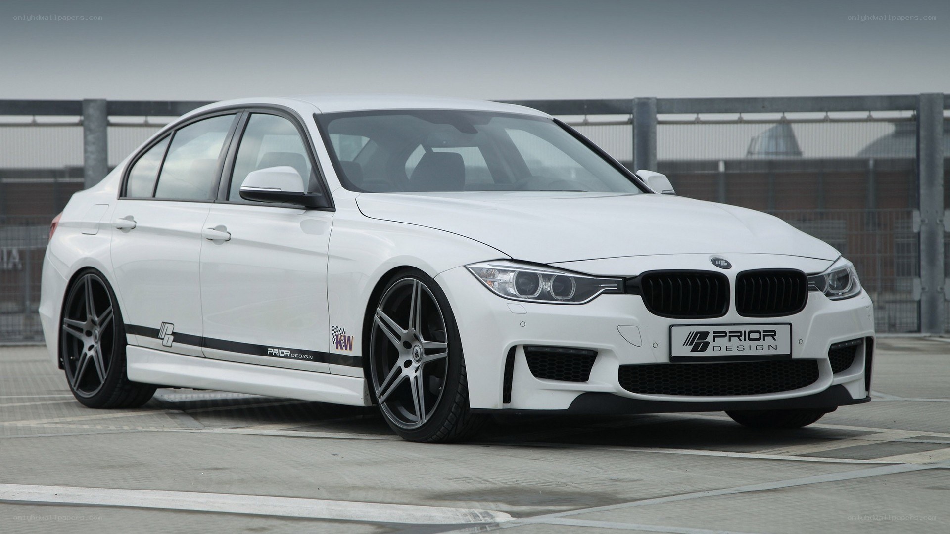 white bmw sedan with prior design