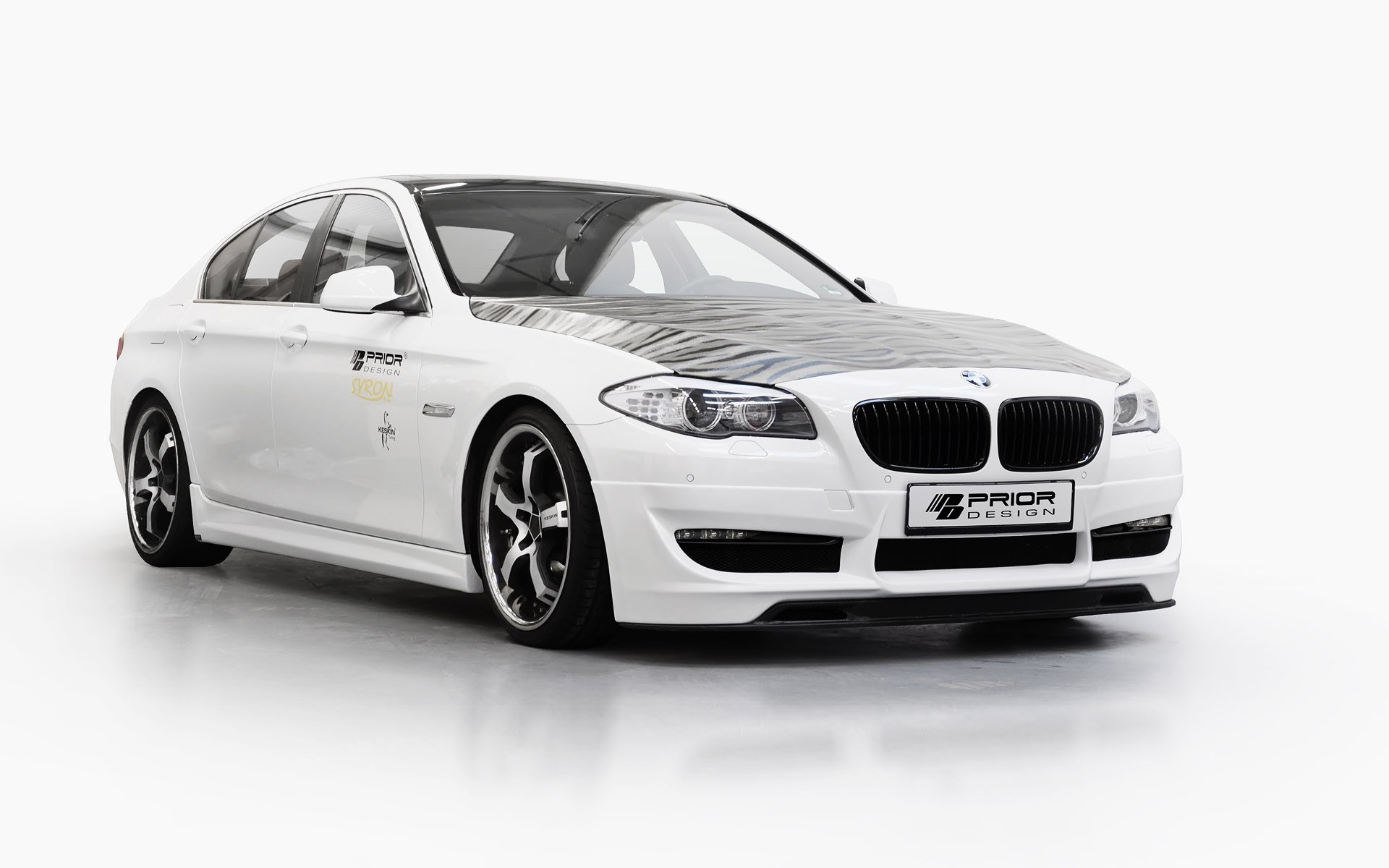 white bmw sedan with prior design