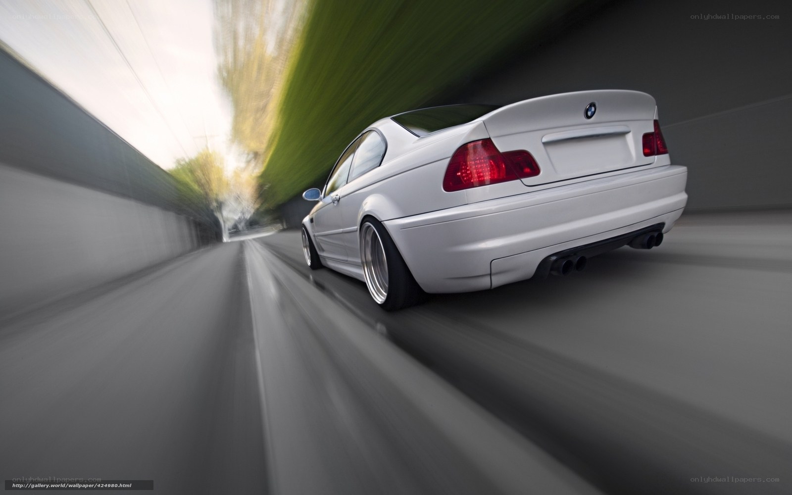White BMW speeding on road
