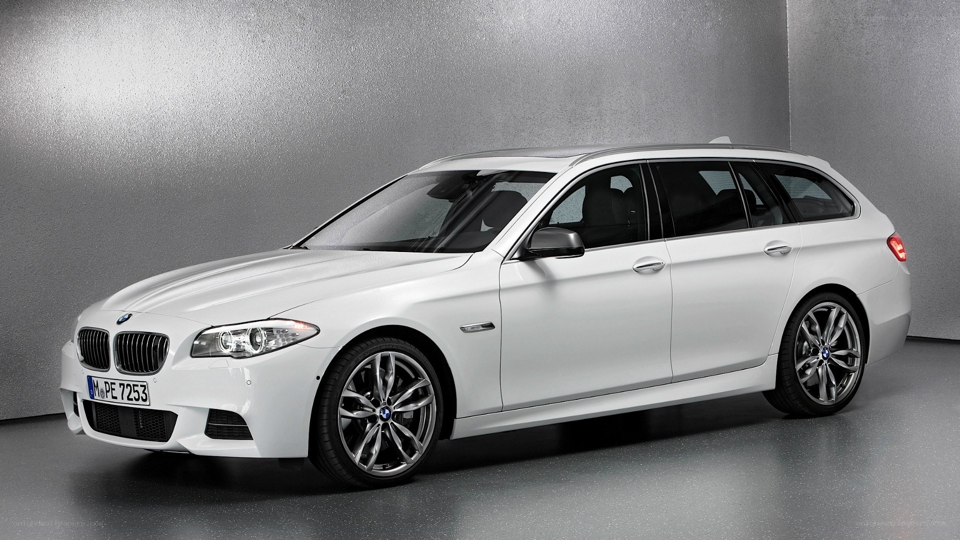 white bmw station wagon