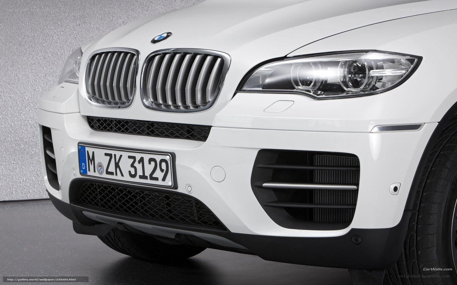 white bmw suv front view