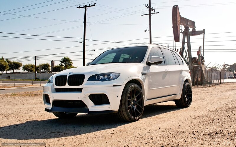 white bmw suv on dirt road