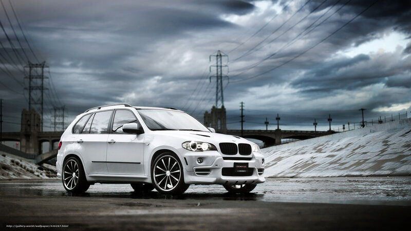 White BMW SUV on wet road